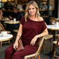 Avslappnad jumpsuit för dam med baraxlad design och korta ärmar