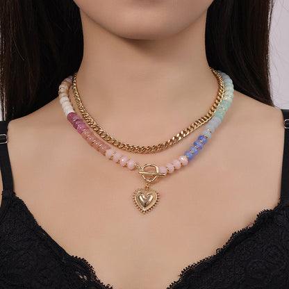 Bohemiskt lager-på-lager-halsband med regnbågsfärgade pärlor och kedja