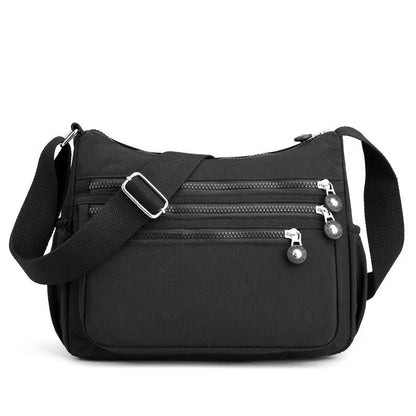 ✨50% RABATT NU! ✨Lätt crossbody-väska i nylon med flera fickor